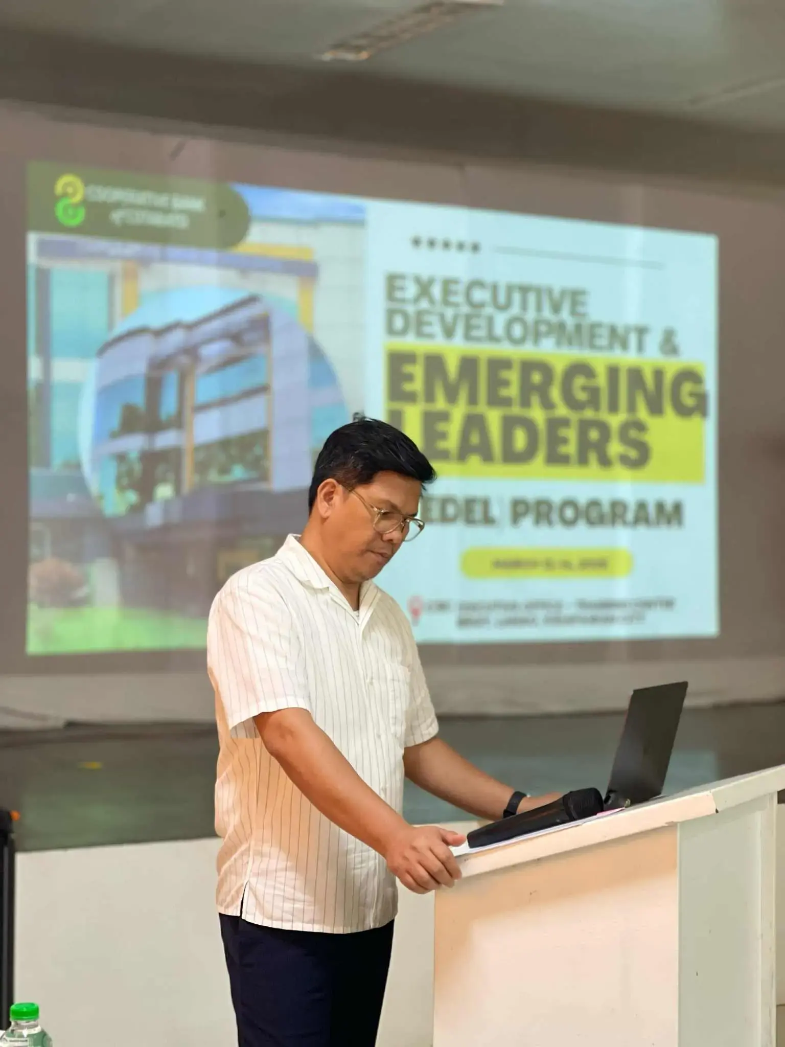 Facilitator preparing to present at the Executive Development and Emerging Leaders Model Program.