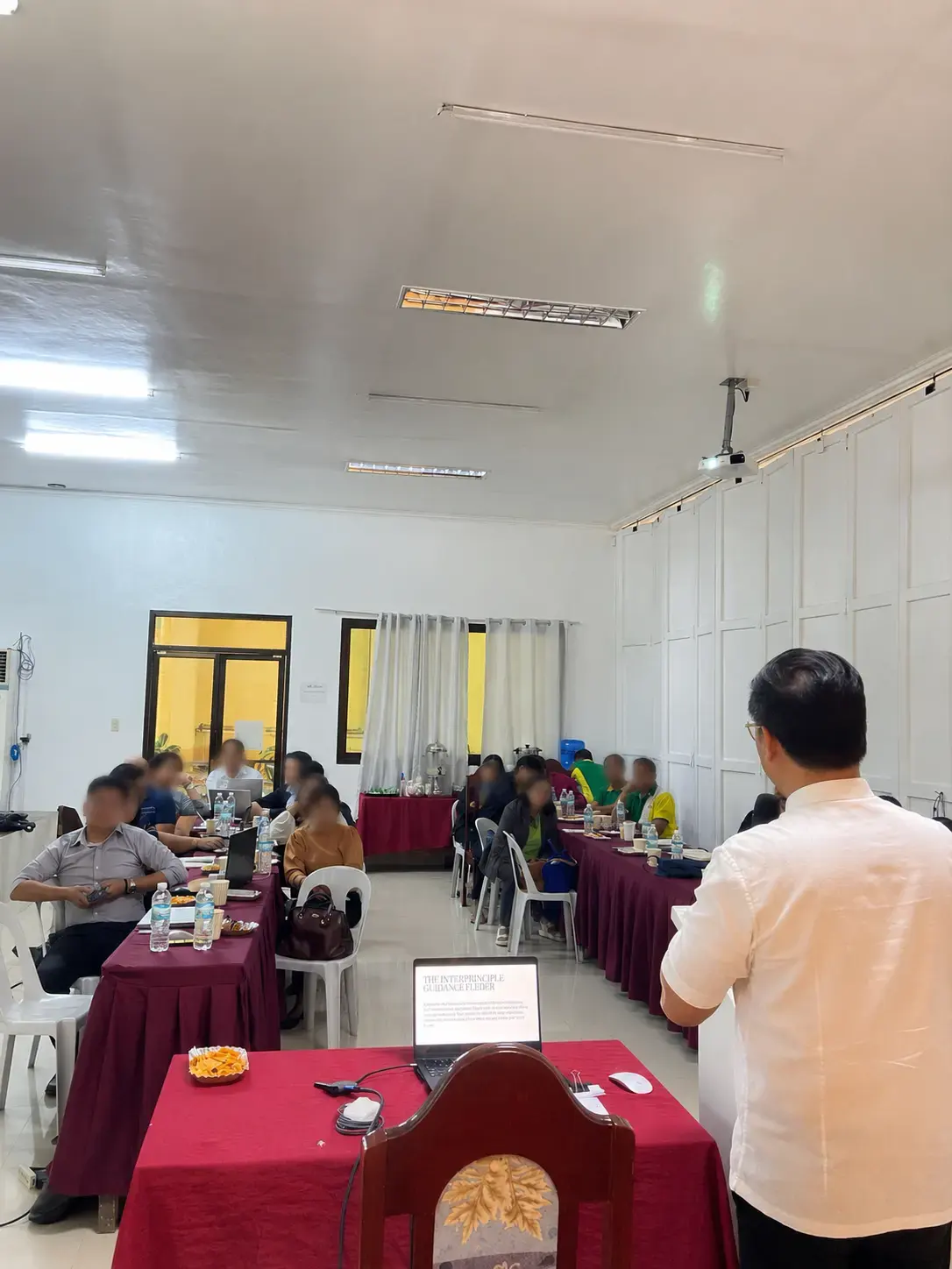 Workshop participants listening to a leadership development presentation.