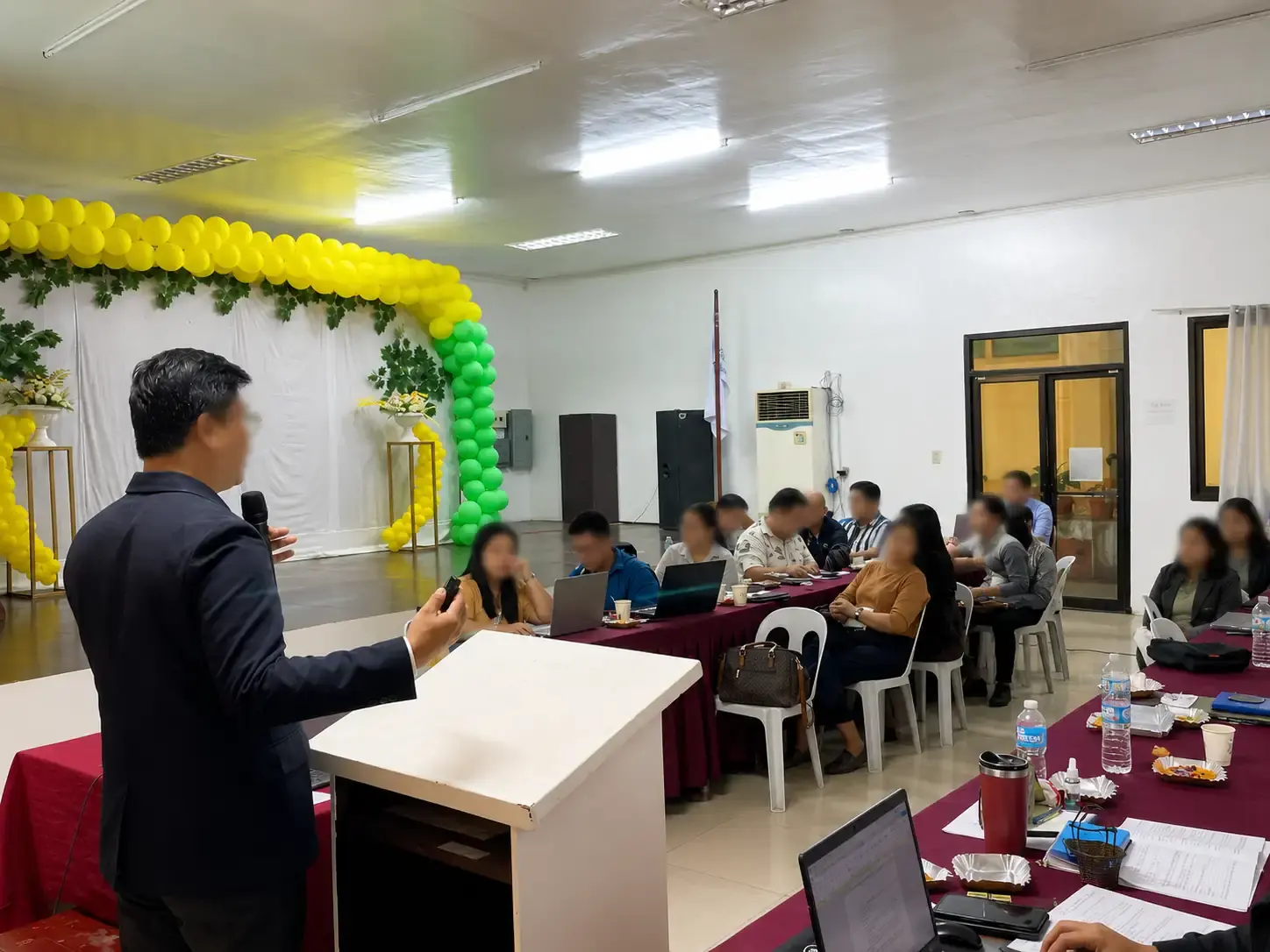 Facilitator engaging with participants during the leadership seminar.
